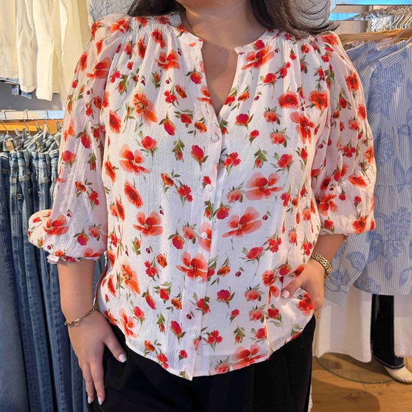 Blus med blomprint