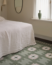 Layered Röllakan Selma Wool Rug Sage